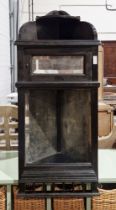 Early 20th century ebonised wooden wall hanging corner unit, having two shelves raised over a single