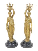 Pair of late 19th century French gilt metal-mounted figures of water carriers, each cast holding a