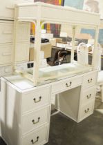 20th century white painted cane-style kneehole desk having a single central long drawer flanked by