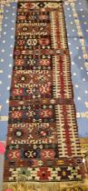 Early 20th century kilim, probably Turkish, woven with geometric bands in red, brown and blue tones,