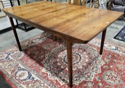 AH McIntosh & Co rosewood extending dining table, rectangular and on circular tapering supports,