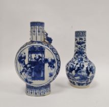 Two Chinese porcelain blue and white Qing Dynasty vases, the first of moonflask form with pierced