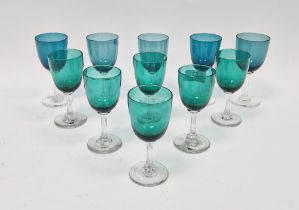 Set of green and turquoise tinted drinking glasses, early 20th century, in various sizes