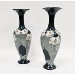 Pair of late 19th century Lambeth Doulton faience blue ground Art Nouveau baluster vases, painted