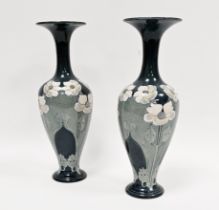 Pair of late 19th century Lambeth Doulton faience blue ground Art Nouveau baluster vases, painted