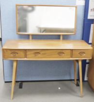 Ercol 'Windsor' range elm dressing table and chair, the rounded rectangular top mounted by