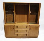 Ercol ''Windsor'' elm dresser, the top with central open, illuminated section with two adjustable