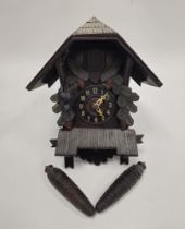 Early 20th century carved Black Forest cuckoo clock, with Arabic numerals to dial, carved with a