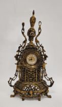 20th century German gilt metal mounted mantel clock, the pierced case surmounted with an urn finial,