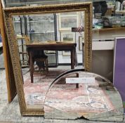 A large modern bevel edged mirror within a gilt decorated frame 100cm h x 71 cm w. with an Art