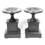 Pair of Victorian slate pedestal tazzas on stands, each cup-shaped tazza supported on a square