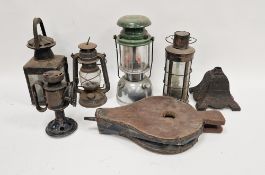 Collection of vintage lanterns and lamps including a reproduction copper and glass lantern, oak