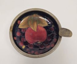 Moorcroft 'Pomegranate' pattern pewter-mounted circular ashtray, tubelined with vignette of