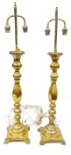 Pair of late 19th/early 20th century baluster brass twin-light lamps, each electrified, with