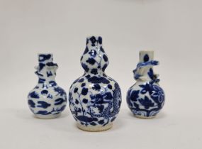 Assembled garniture of three Chinese porcelain blue and white miniature vases, Qing Dynasty,