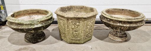 Pair of reconstituted stone small garden urns and a hexagonal garden urn with decorated sides,