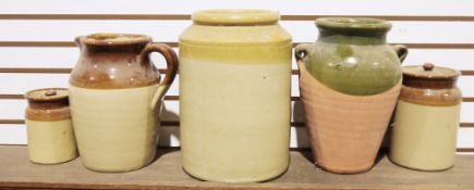 Three stoneware storage jars (one missing lid), the smaller two bearing 'Made in England' mark to