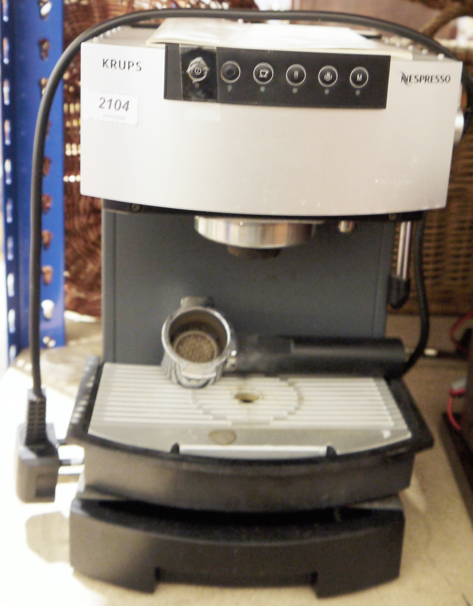 Krups Nespresso coffee machine with instructions