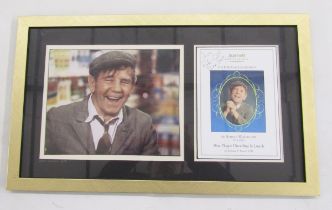 Collection of memoirs and autobiographies signed by Norman Wisdom, a framed photograph and