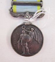 Victorian Crimea medal with Sebastopol clasp, named to 'No 2139 James Cock 17th Regt'.