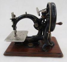 Vintage Willcox & Gibbs (USA) automatic 'Silent Sewing Machine' on wooden mount, with original