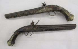 Pair of decorative flintlock pistols.