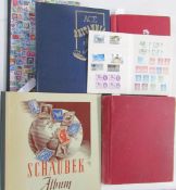 All world stamps: collection of 4 albums and 2 stockbooks in bag of mostly used post-1920