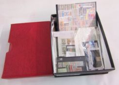 World stamps: Boxed accumulation including red sleeved Lindner album with stock-cards, packets,