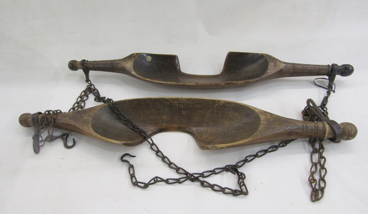 Two turned vintage wooden yokes and chains (2)