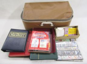 World stamps: Muddled accumulation in suitcase of mostly mint & used definitives & commemoratives in