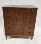Mid-century teak veneered chest of drawers comprising five long drawers, raised on squared