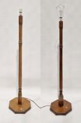 Pair of Kevin Burks oak standard lamps raised on octagonal pedestal base, 138cm high excluding