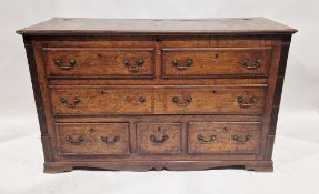 George III oak mule chest, the hinged panel top over three dummy and three real drawers, raised on