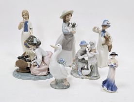 Group of Lladro, Nao, Rex and other porcelain figures similar, including a Lladro group of a girl