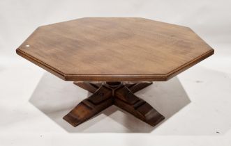 Oak octagonal coffee table on baluster column and quadruped base, 106cm wide