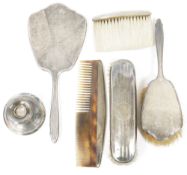 Silver-mounted hand mirror and matching silver-mounted hairbrush, engine-turned, Birmingham assay,