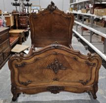 19th century mahogany 4' bedframe, the head and footboard with ornate carved and pierced scrolling