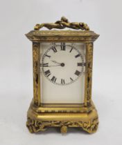 French late 19th century gilt-brass mounted carriage clock, with figural swing handle above bevelled