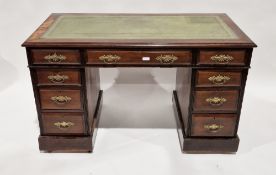 Early 20th century mahogany kneehole desk, the central drawer flanked by four short drawers on