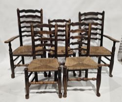 Set of six oak ladderback dining chairs with rush seats, two being carvers, 112cm high (6)