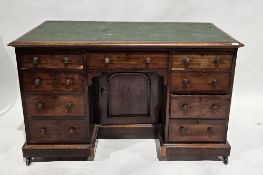 Victorian mahogany kneehole desk with leatherette insert to the top, raised over a single long