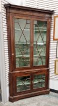 Large Victorian mahogany glazed corner display cabinet in two sections, the top section having two