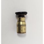 Early 20th century military issue brass lens with screw fitting, stamped LOW, with arrow marks 5.5cm