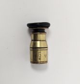 Early 20th century military issue brass lens with screw fitting, stamped LOW, with arrow marks 5.5cm