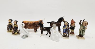 Five Goebel figures of children, a Lladro figure of a swan, a Nao figure of an angel, a Beswick