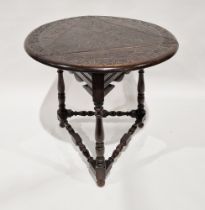 Victorian oak occasional table, the circular top with three drop leaves and carved leaf