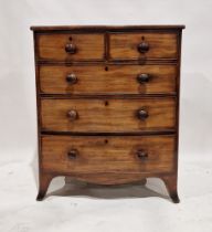 Victorian mahogany bowfronted chest of two short over three long drawers, each with turned knob