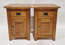 Pair of modern pine bedside cabinets, each fitted with a single drawer over a cupboard, 65cm high