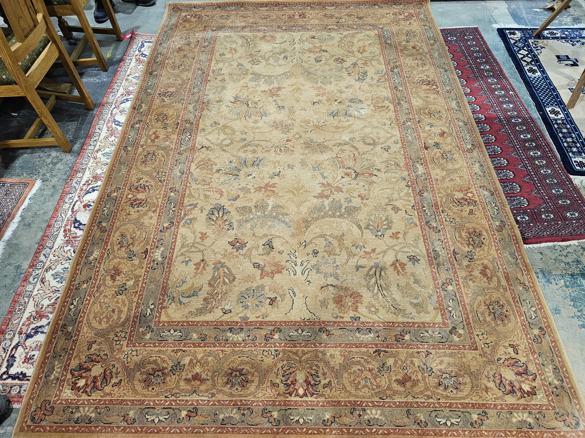 Modern cream ground Royal Keshan wool pile carpet with central floral pattern, multiple floral and