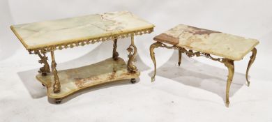 Large two-tier onyx coffee table of rectangular form, the top section raised on four brass fish,